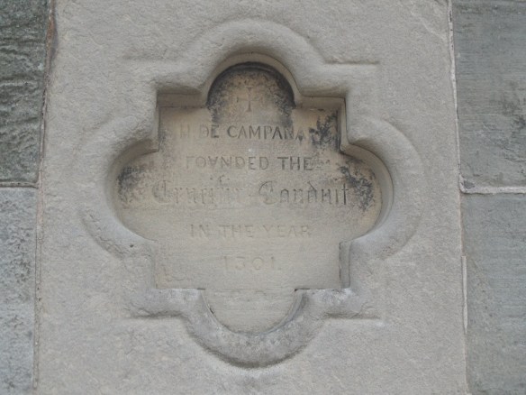 Plaque on Lichfield's Clock Tower, the base of which was once the water conduit which stood near the Friary.