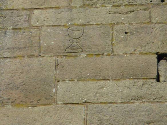 Chalice carving on Gnosall church tower (photo by Kenneth Ingram)