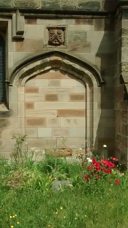Above this blocked doorway at St James is the coat of arms of John Taylor. Look closely and you'll se it features three little heads, representing John and his brothers.